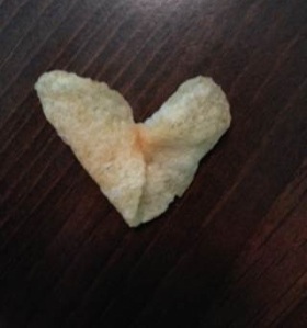 Photo taken by Cindi Lynch of a heart-shaped potato chip she found in her pile of chips.